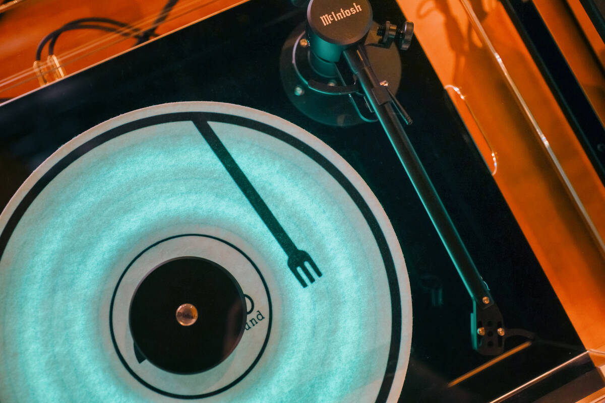 A turntable lights up at Echo Sound and Taste, a new restaurant and music lounge in the Arts Di ...