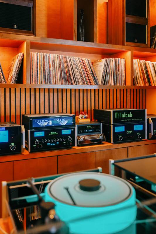 Music equipment and records sit along the back wall of the DJ booth at Echo Sound and Taste, a ...