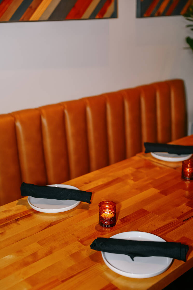 A candle glows on a dining table at Echo Sound and Taste, a new restaurant and music lounge in ...