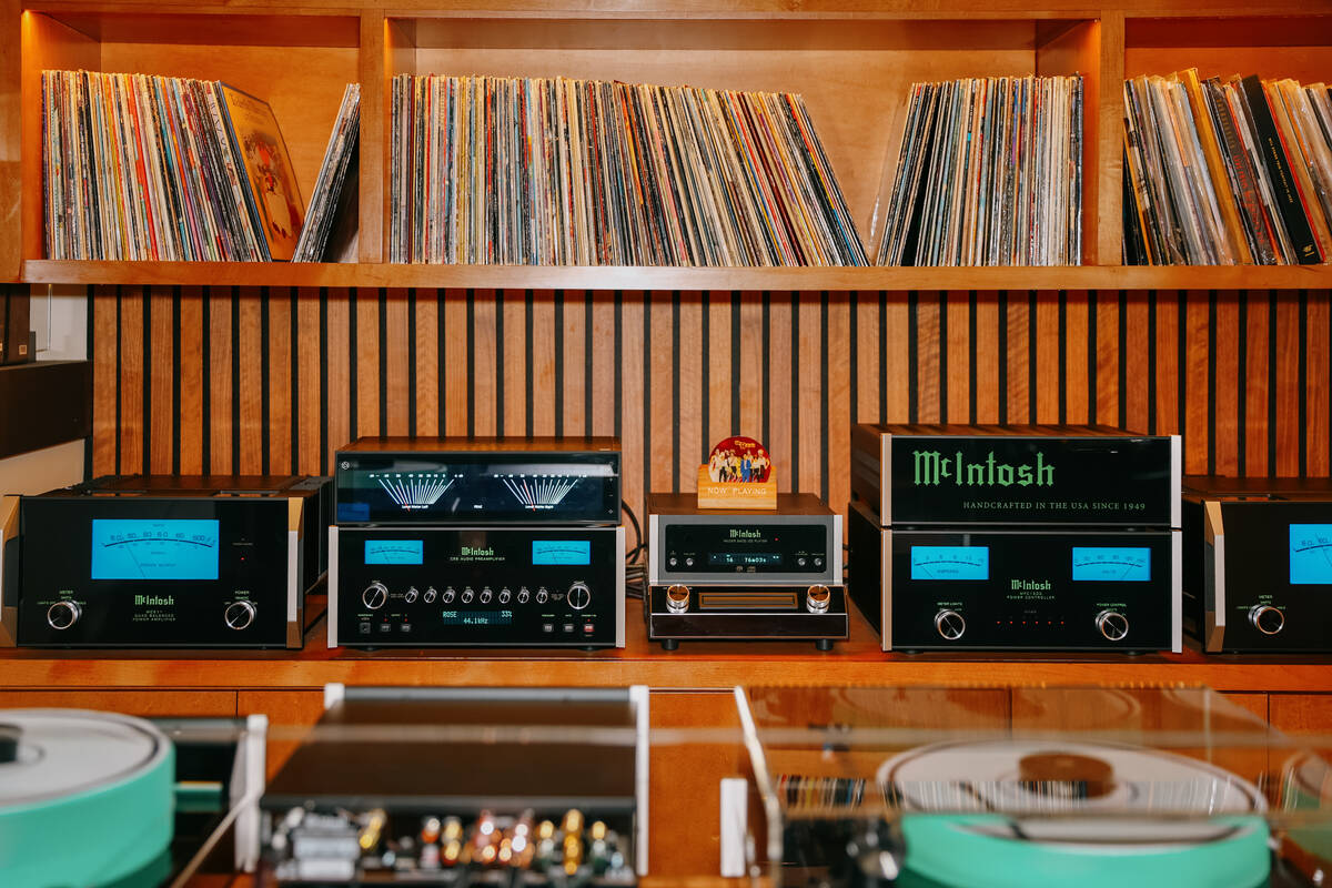 Music equipment and records sit along the back wall of the DJ booth at Echo Sound and Taste, a ...