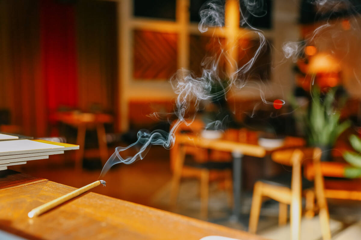 Incense burns at the edge of the hostess table before the opening of Echo Sound and Taste, a ne ...