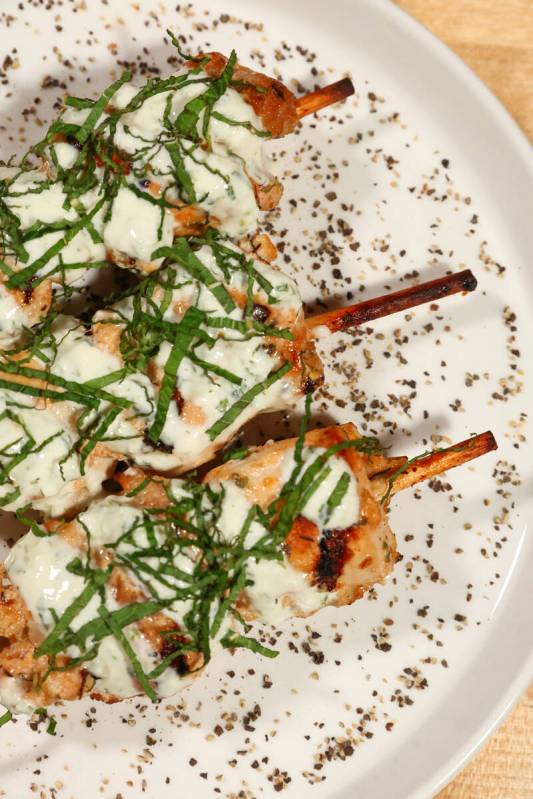 The grilled Mediterranean chicken skewers with tzatziki sauce at Echo Taste & Sound in the Arts ...