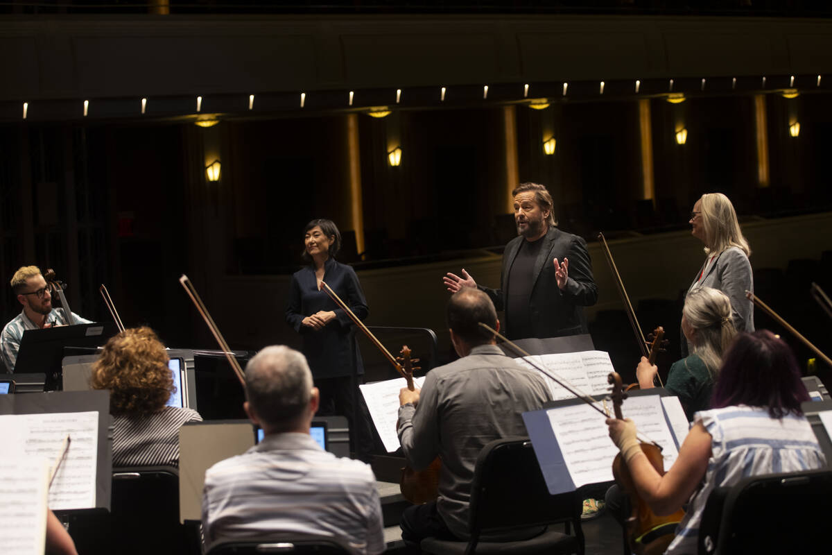 Ventriloquist Terry Fator speaks with members of the Las Vegas Philharmonic alongside executive ...