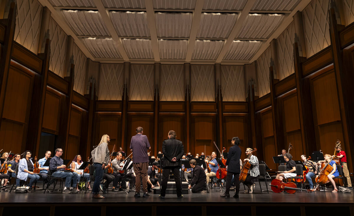 Ventriloquist Terry Fator, center, listens to a rehearsal of the Las Vegas Philharmonic at Reyn ...