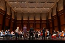 Ventriloquist Terry Fator, center, listens to a rehearsal of the Las Vegas Philharmonic at Reyn ...