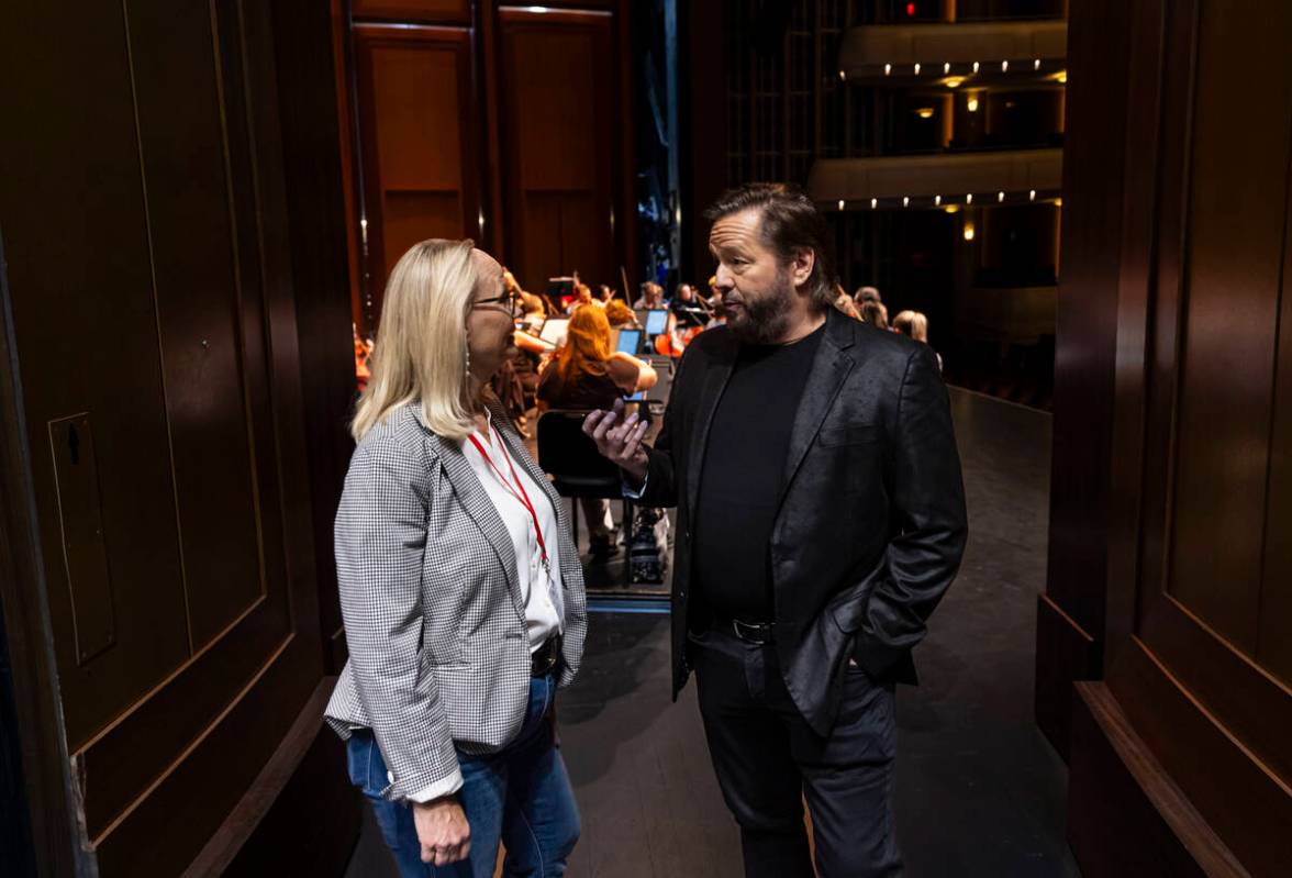 Alice Sauro, Executive Director of the Las Vegas Philharmonic, left, talks with ventriloquist T ...