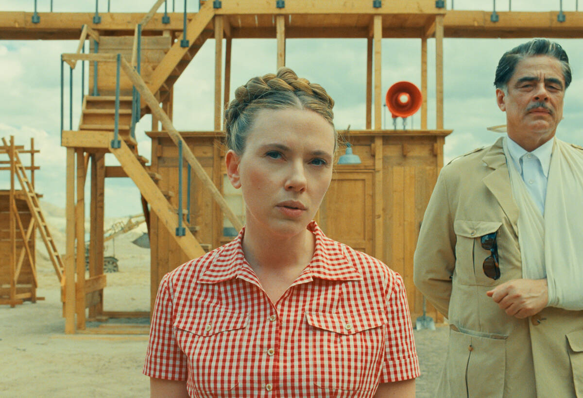 This image released by Focus Features shows Scarlett Johansson, center, and Benicio Del Toro in ...