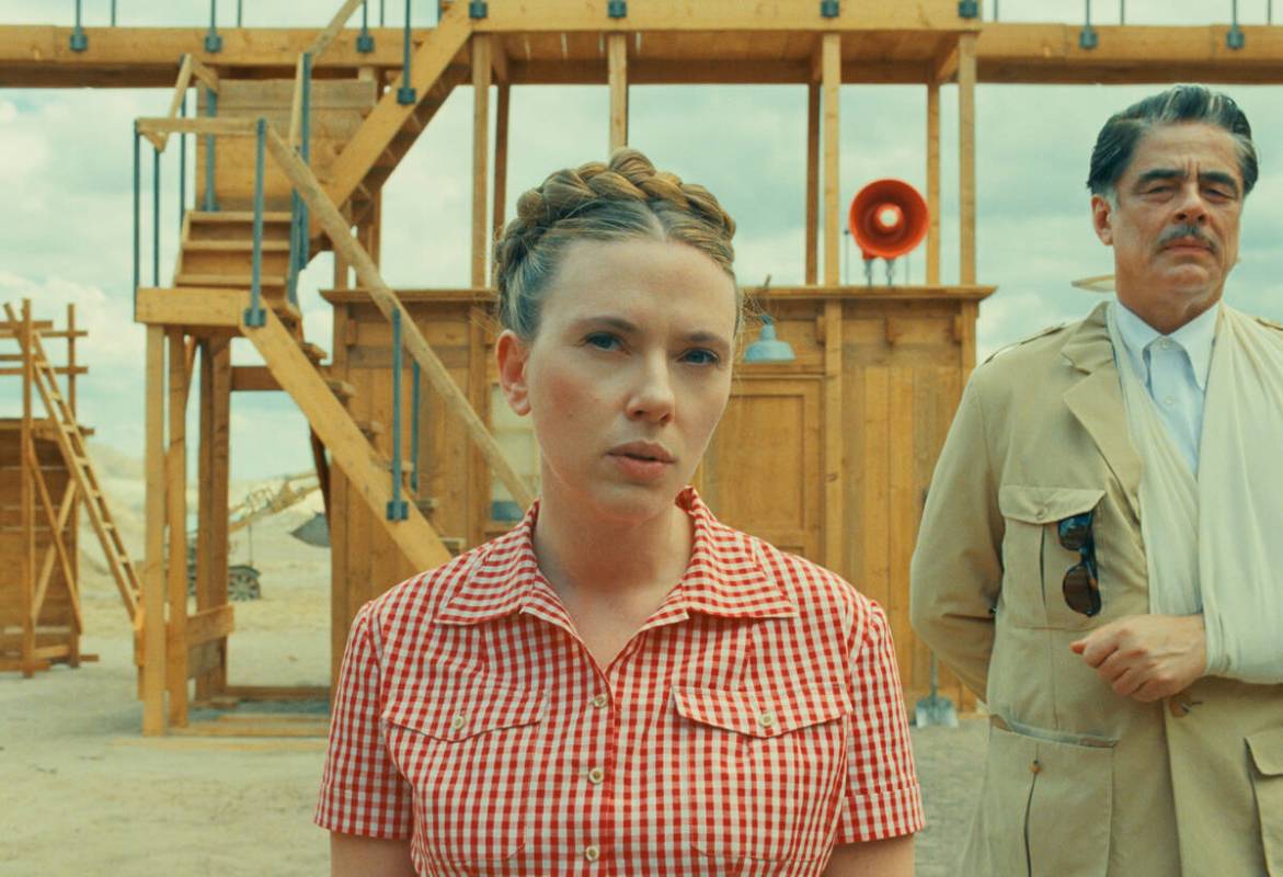 This image released by Focus Features shows Scarlett Johansson, center, and Benicio Del Toro in ...