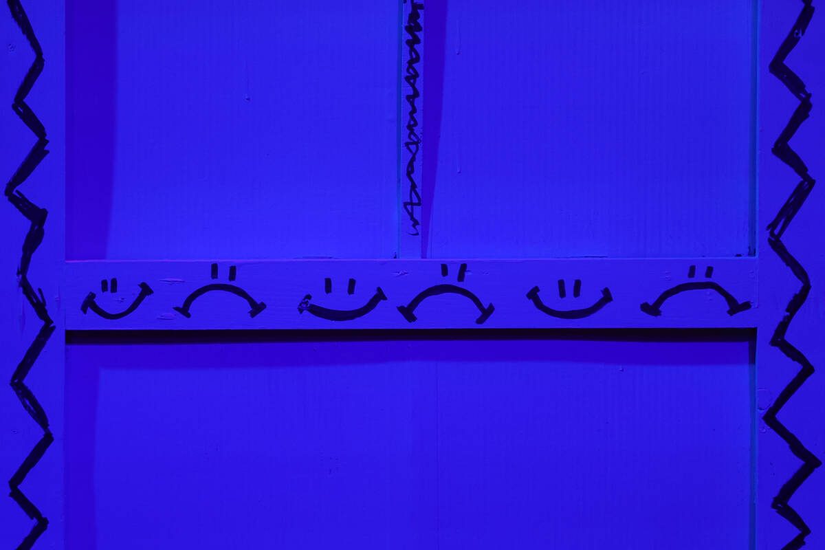 A prop puppet theatre decorated with smiley and frowny faces sits onstage before Majestic Reper ...
