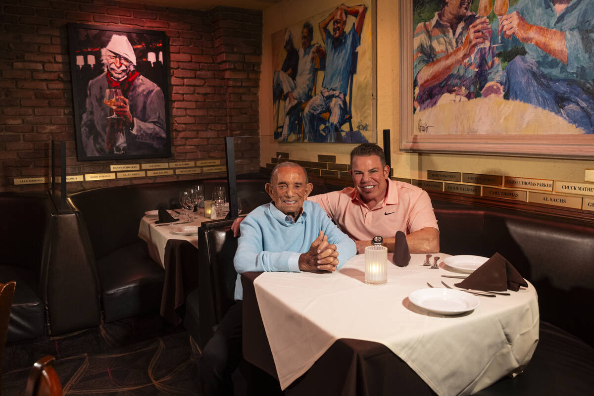 Freddie Glusman, left, poses for a portrait with Steve Siegel of The Siegel Group at Piero's It ...
