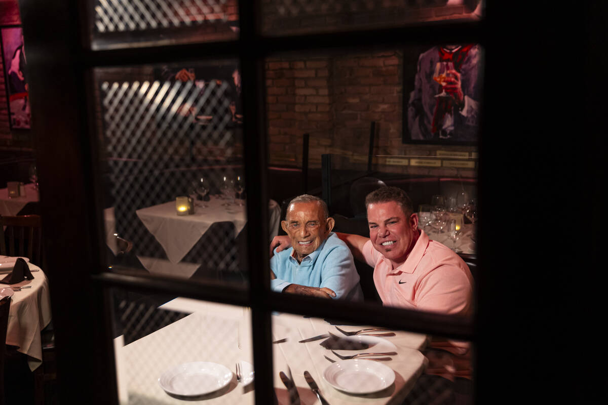 Freddie Glusman, left, poses for a portrait with Steve Siegel of The Siegel Group at Piero's It ...
