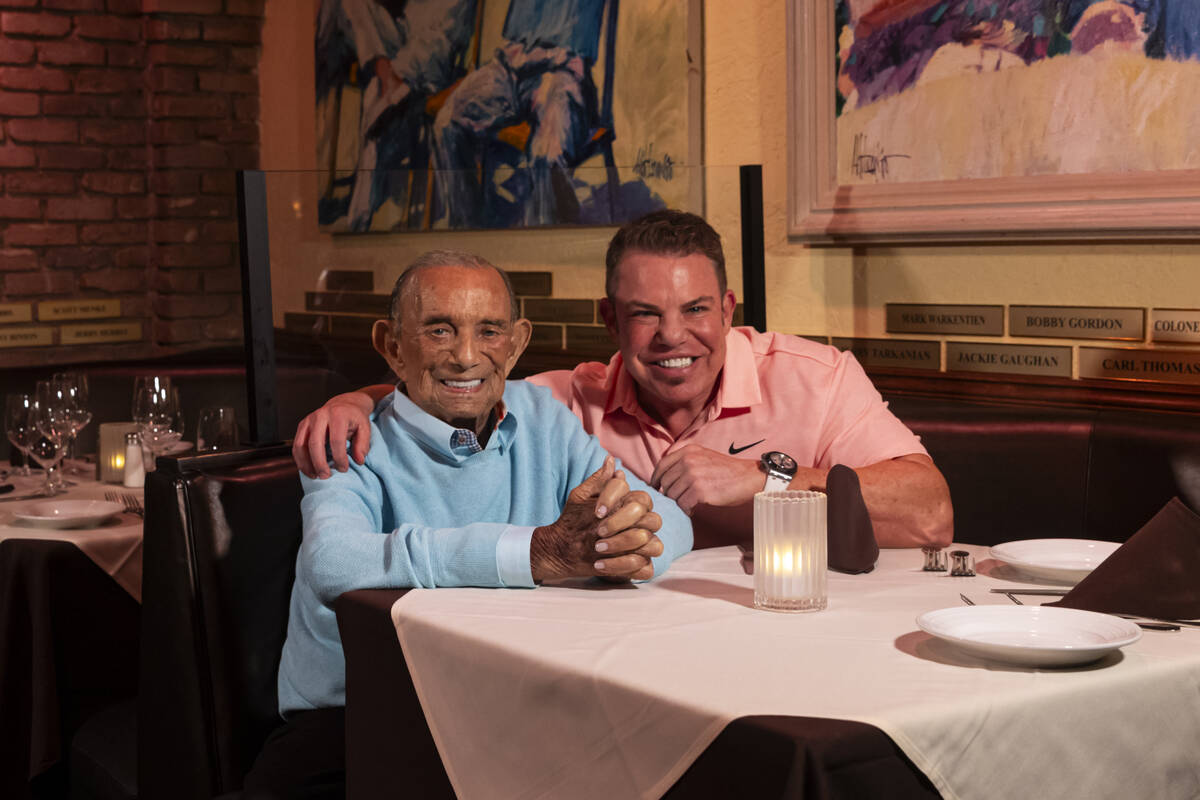 Freddie Glusman, left, poses for a portrait with Steve Siegel of The Siegel Group at Piero's It ...