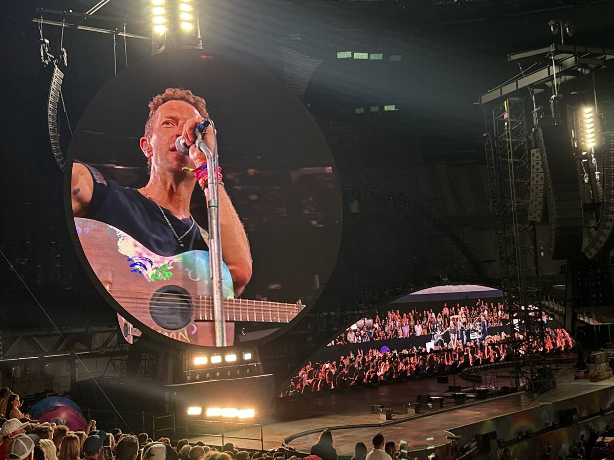 Chris Martin of Coldplay is shown during the "Music of the Spheres" tour stop at Allegiant Stad ...
