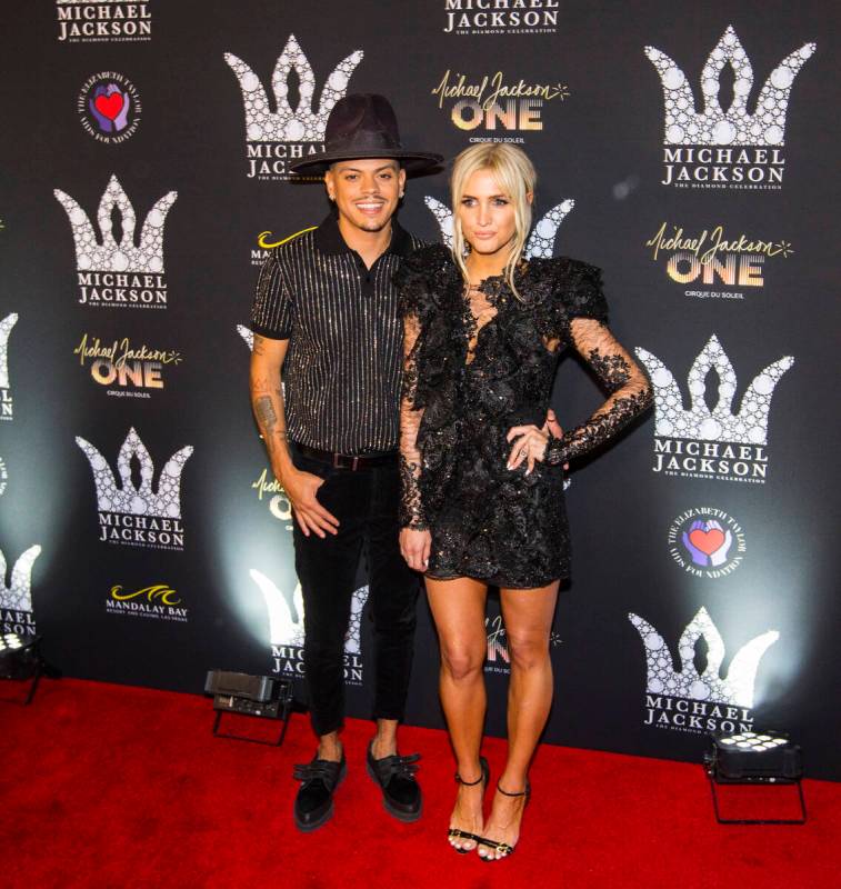 Evan Ross, left, and Ashlee Simpson pose on the red carpet ahead of the Michael Jackson 60th bi ...