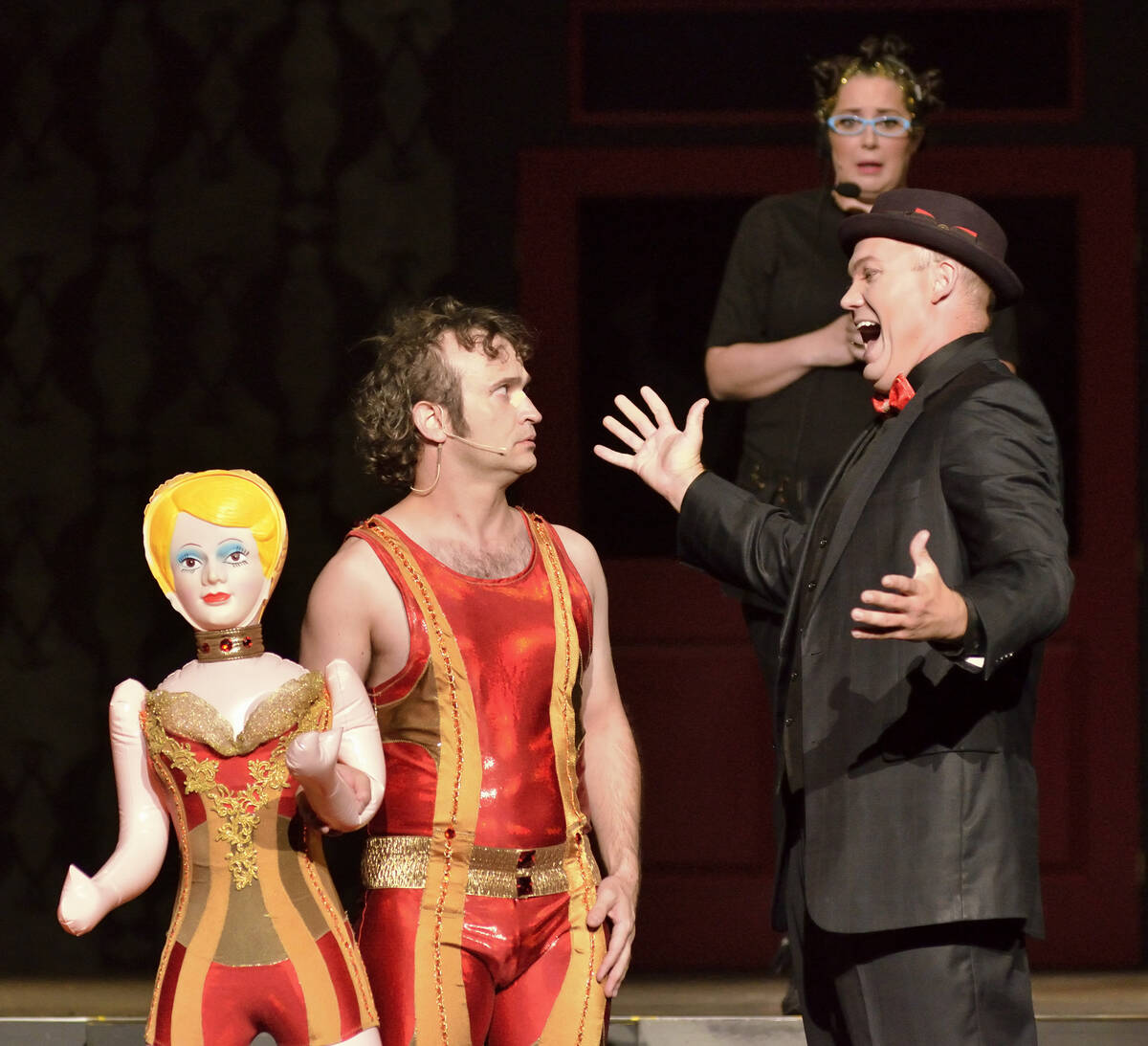 Jimmy Slonina, left, Will Howard, right, and Kelsey Custard perform during the Circus Couture & ...