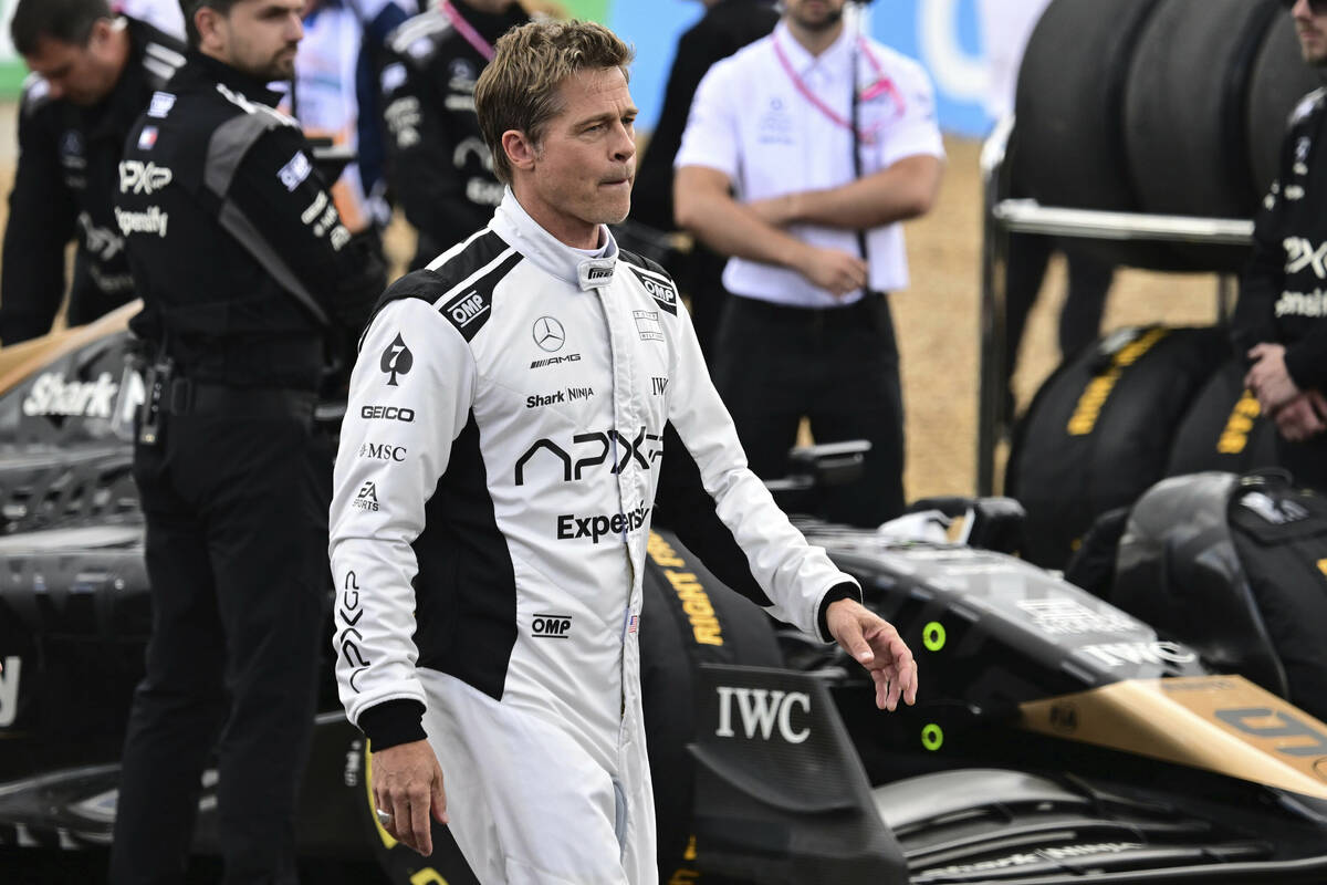 Actor Brad Pitt walks through the paddock before the British Formula One Grand Prix race at the ...