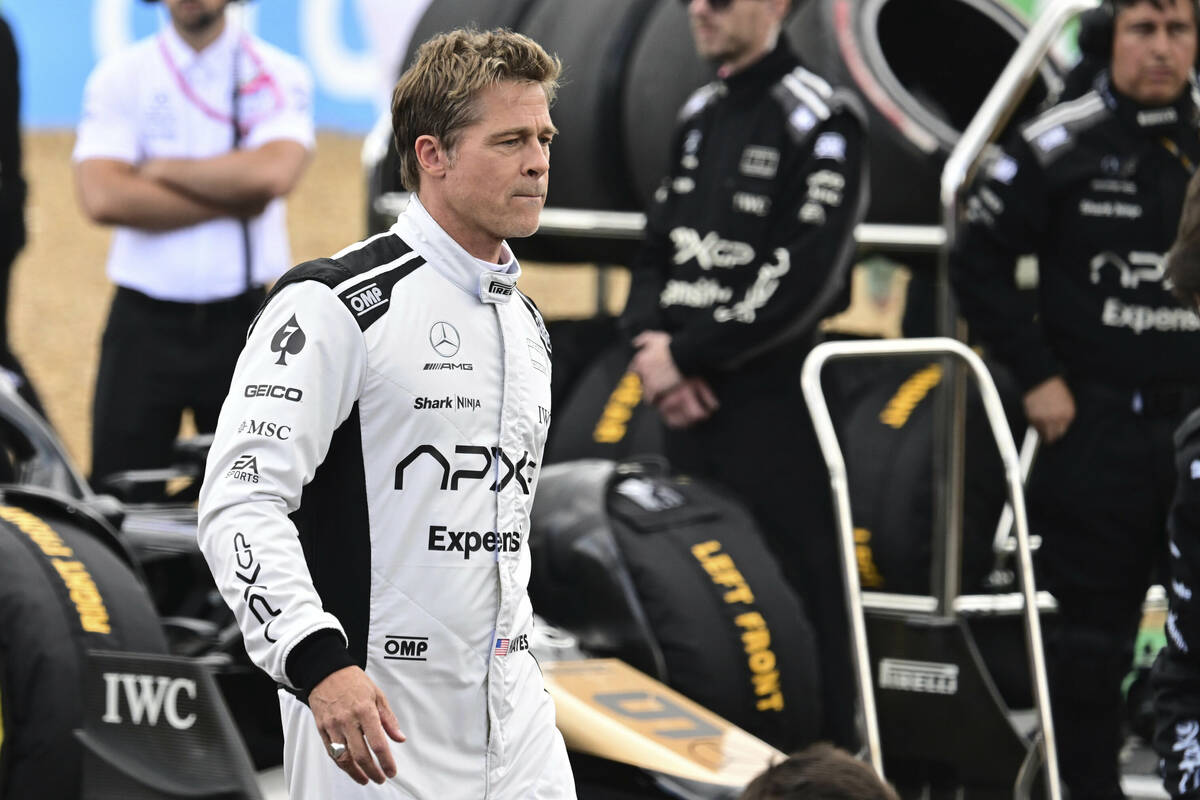 Actor Brad Pitt walks through the paddock before the British Formula One Grand Prix race at the ...