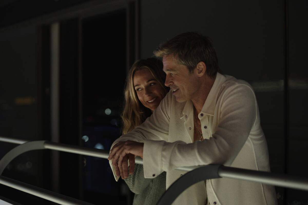 Kerry Condon as Kate and Brad Pitt as Sonny Hayes in “F1® The Movie," (Warner Bros. Pictures ...