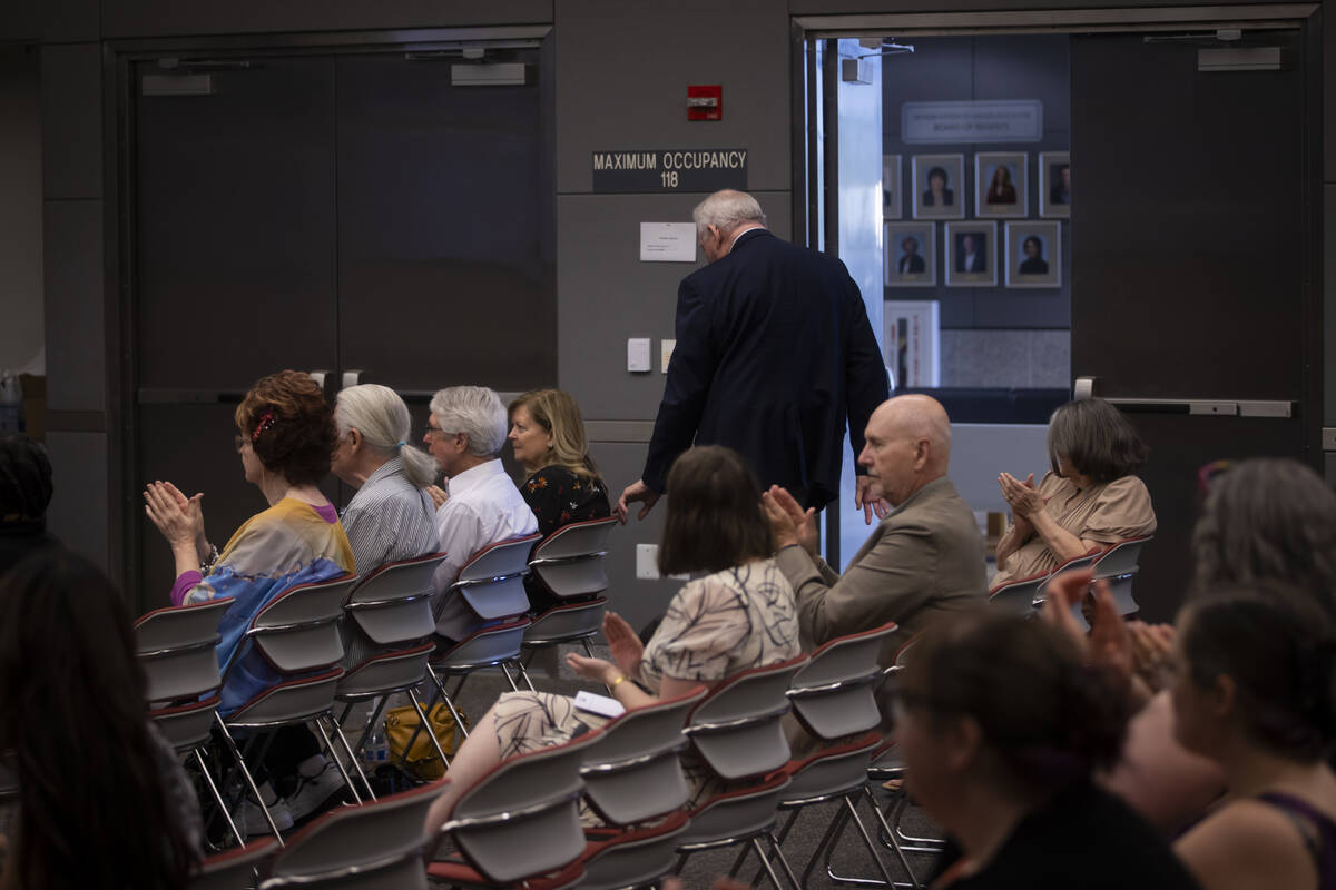 Attendees clap as Atomic Museum founding member and historian Robert Friedrichs gets up to spea ...
