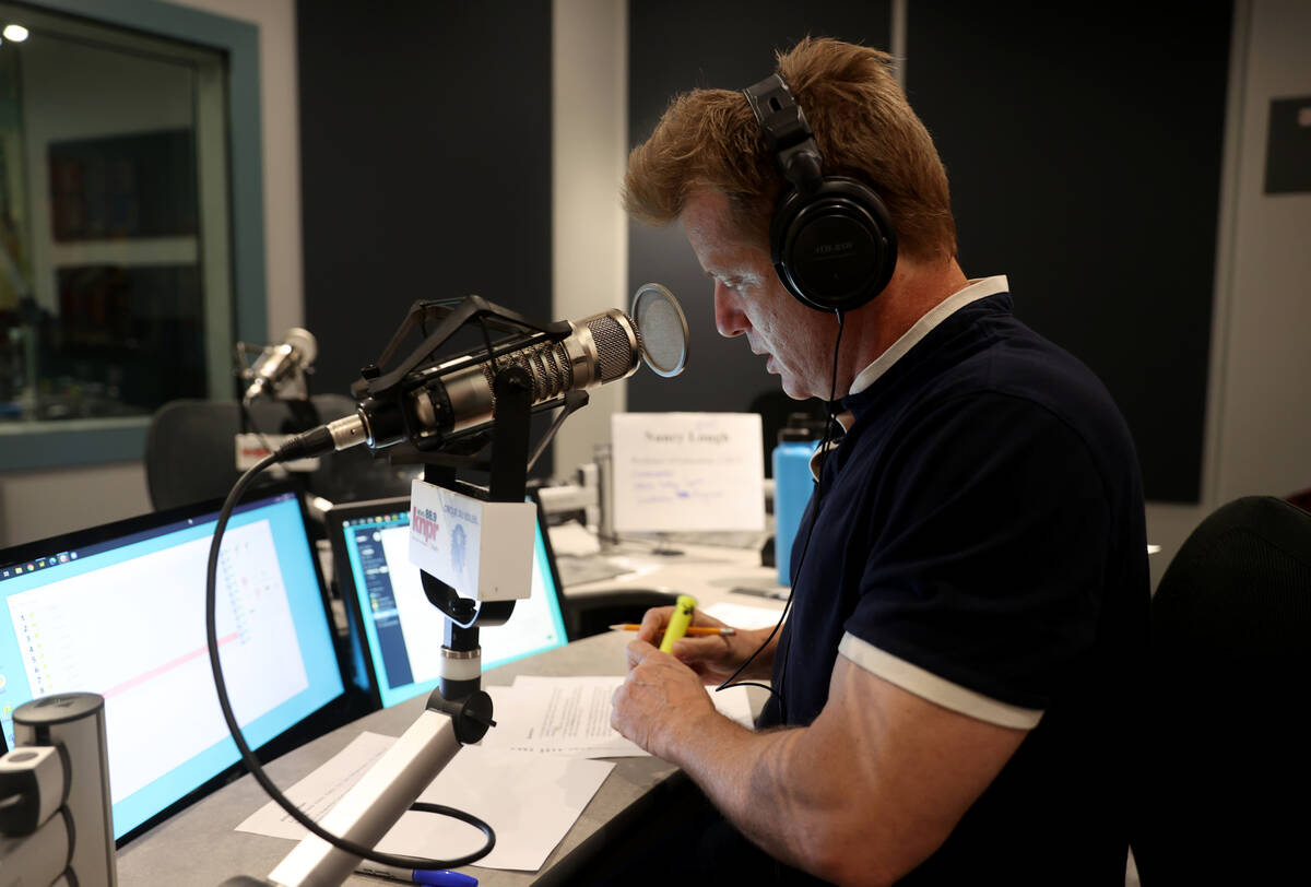 "State of Nevada" host Joe Schoenmann prepares for a show at Nevada Public Radio in L ...