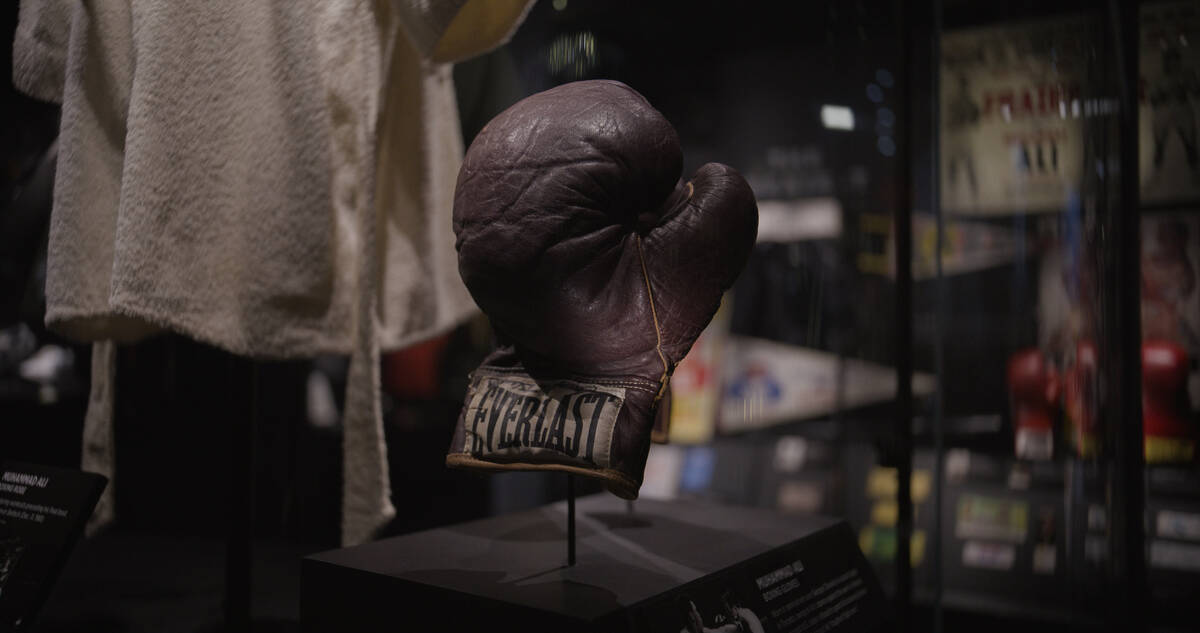Muhammad Ali's gloves worn in the legends bout with George Chuvalo are shown at Hall of Excelle ...