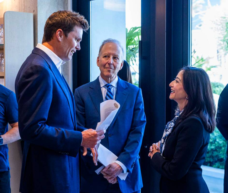 Tom Brady talks with Jim and Frann Nance arriving for the Hall of Excellence Press Conference a ...