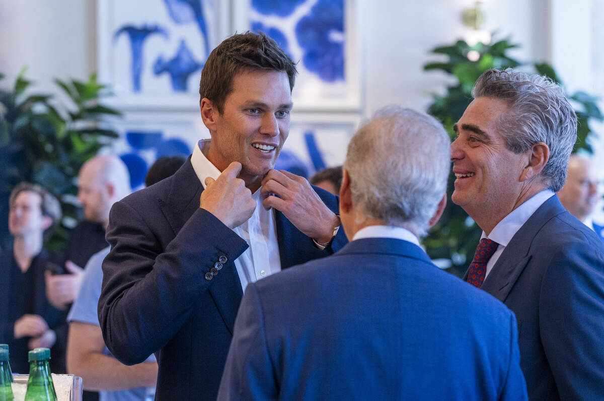 Tom Brady talks with Jim Nance and Jeffrey Soffer, the Chairman and Chief Executive Officer of ...