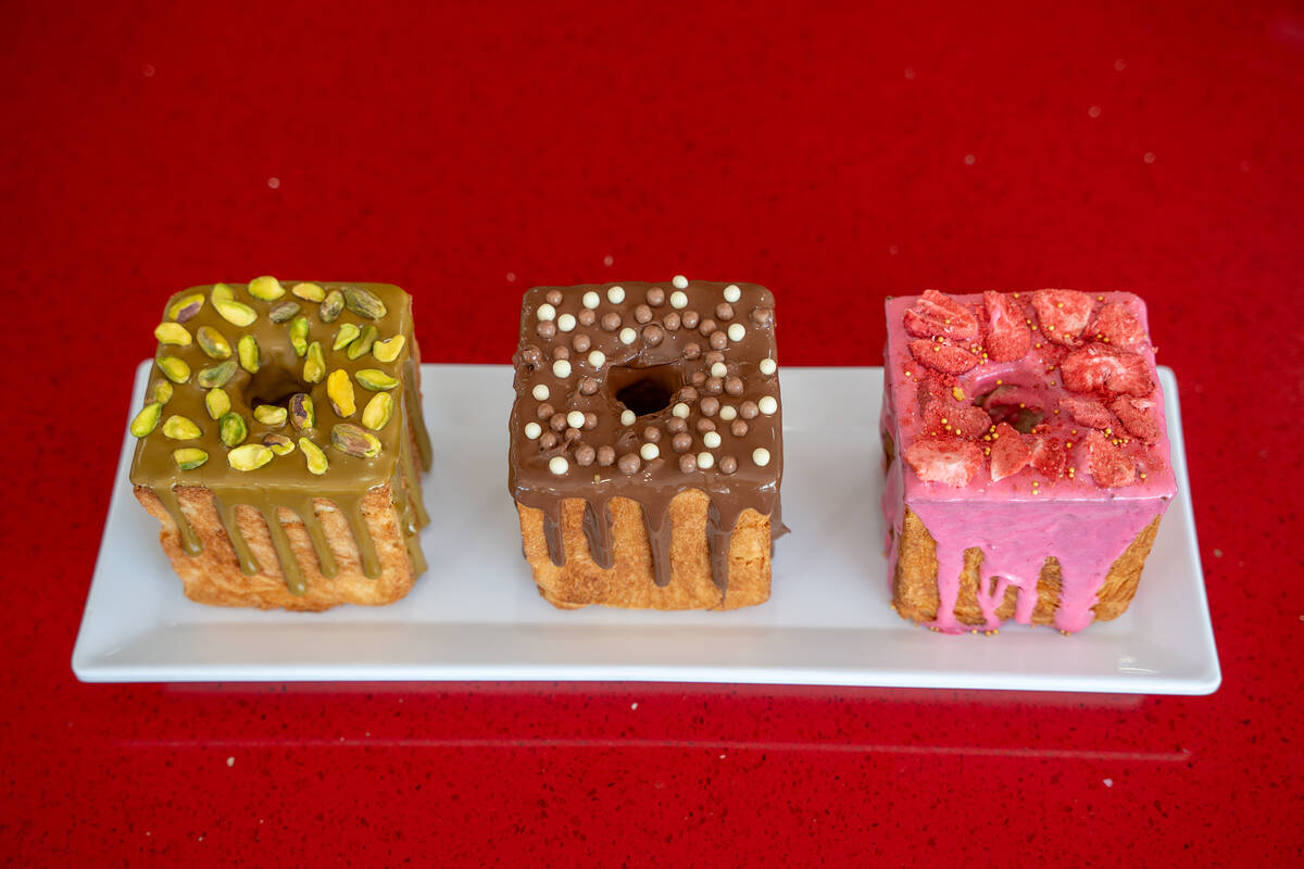 Pistachio, chocolate and strawberry variations of Wicked Donuts’ new cube-shaped doughnu ...