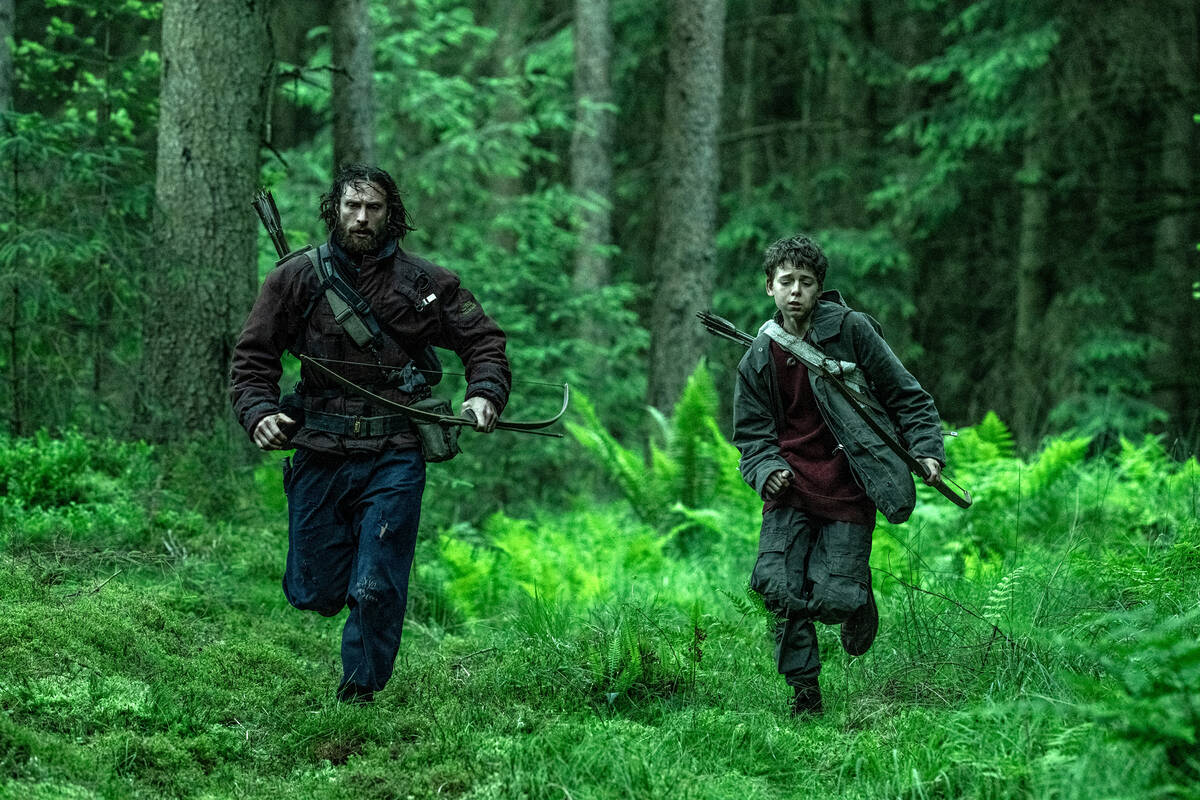 Aaron Taylor-Johnson (left) and Alfie Williams in Columbia Pictures' "28 Years Later.&quot ...