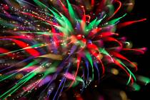 In this July 4, 2018, file photo, fireworks explode from a launchpad behind the Moapa Paiute Tr ...