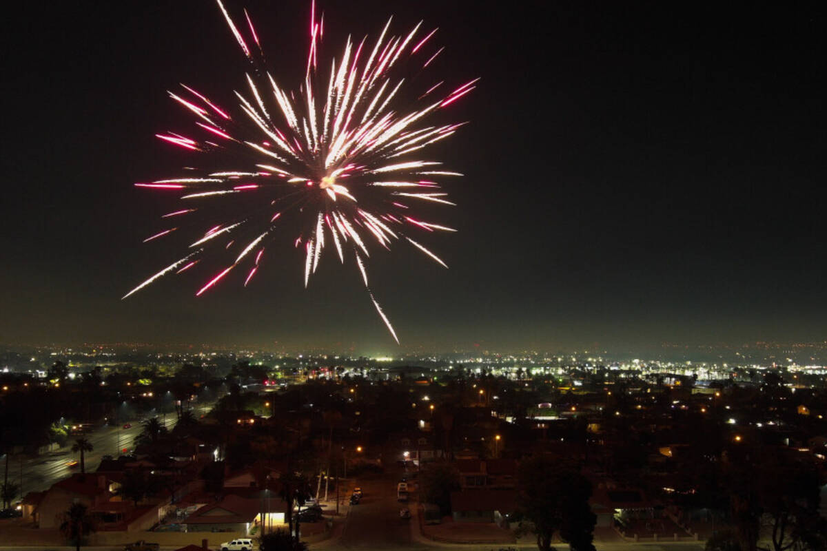 Fireworks explode over a neighborhood on the east side of Las Vegas Thursday, July 4, 2024. (Sa ...