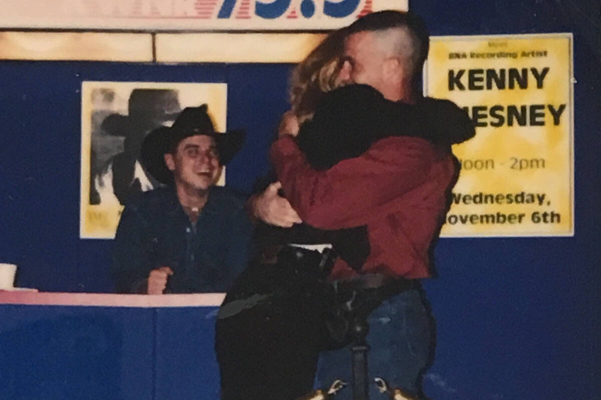 Dane and Lisa Mattoon hug after Dane's proposal at Texas Station on Nov. 9, 1996. Budding count ...