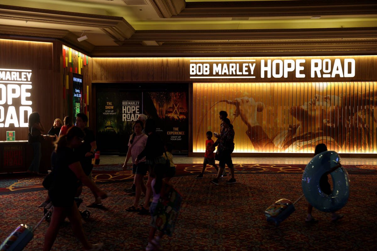Guests walk past the entrance to the Bob Marley Hope Road interactive show and immersive experi ...