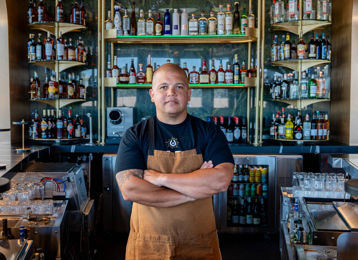 Chef-owner Brad Wise stands in the bar of his restaurant, Rare Society, a live-fire steakhouse ...