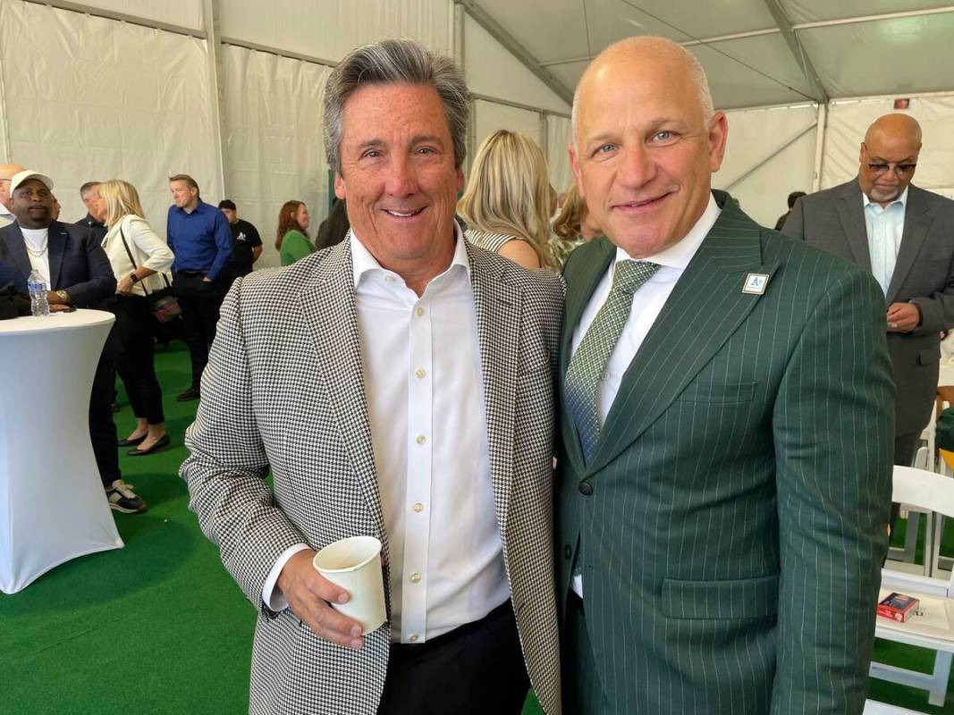 MGM Resorts International President and CEO Bill Hornbuckle is shown with Athletics President M ...