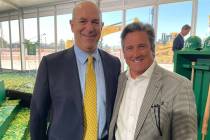MGM Resorts International President and CEO Bill Hornbuckle is shown with Athletics owner John ...