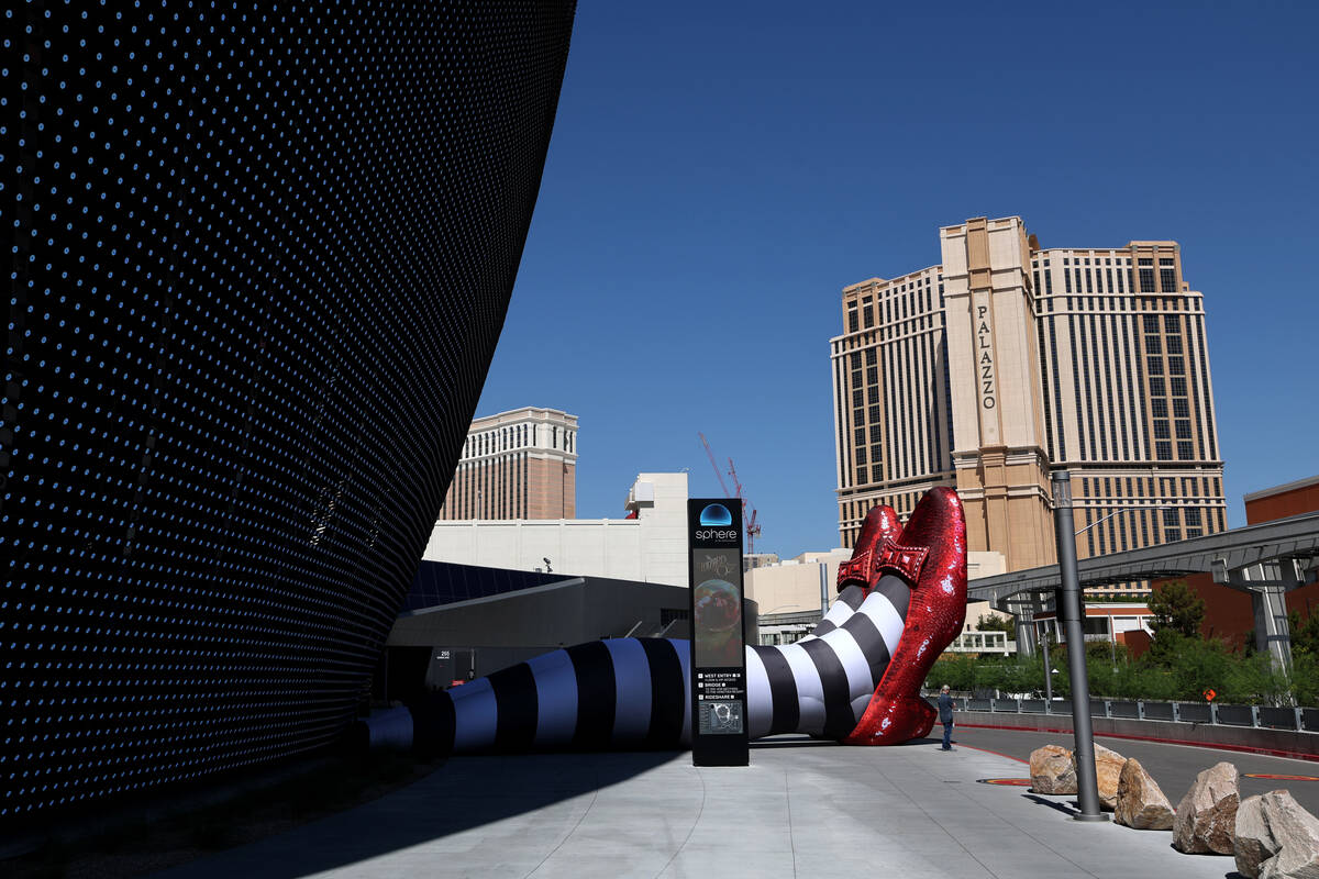 The Wicked Witch of the East legs and ruby slippers installation is seen to promote The Wizard ...