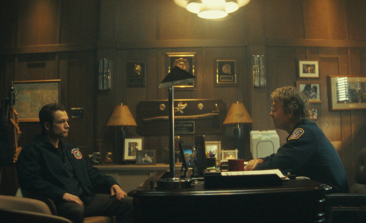This image released by Apple TV+ shows Taron Egerton, left, and Greg Kinnear in a scene from &q ...