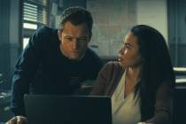 This image released by Apple TV+ shows Taron Egerton, left, and Jurnee Smollett in a scene from ...