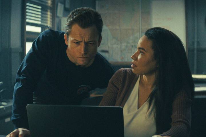 This image released by Apple TV+ shows Taron Egerton, left, and Jurnee Smollett in a scene from ...