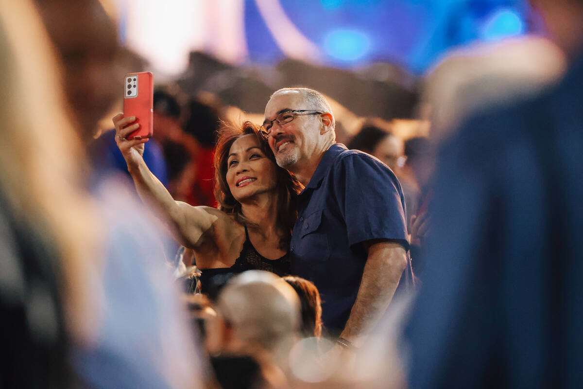 Fans take a selfie during a Shakira concert at Allegiant Stadium Saturday June 28, 2025 in Las ...