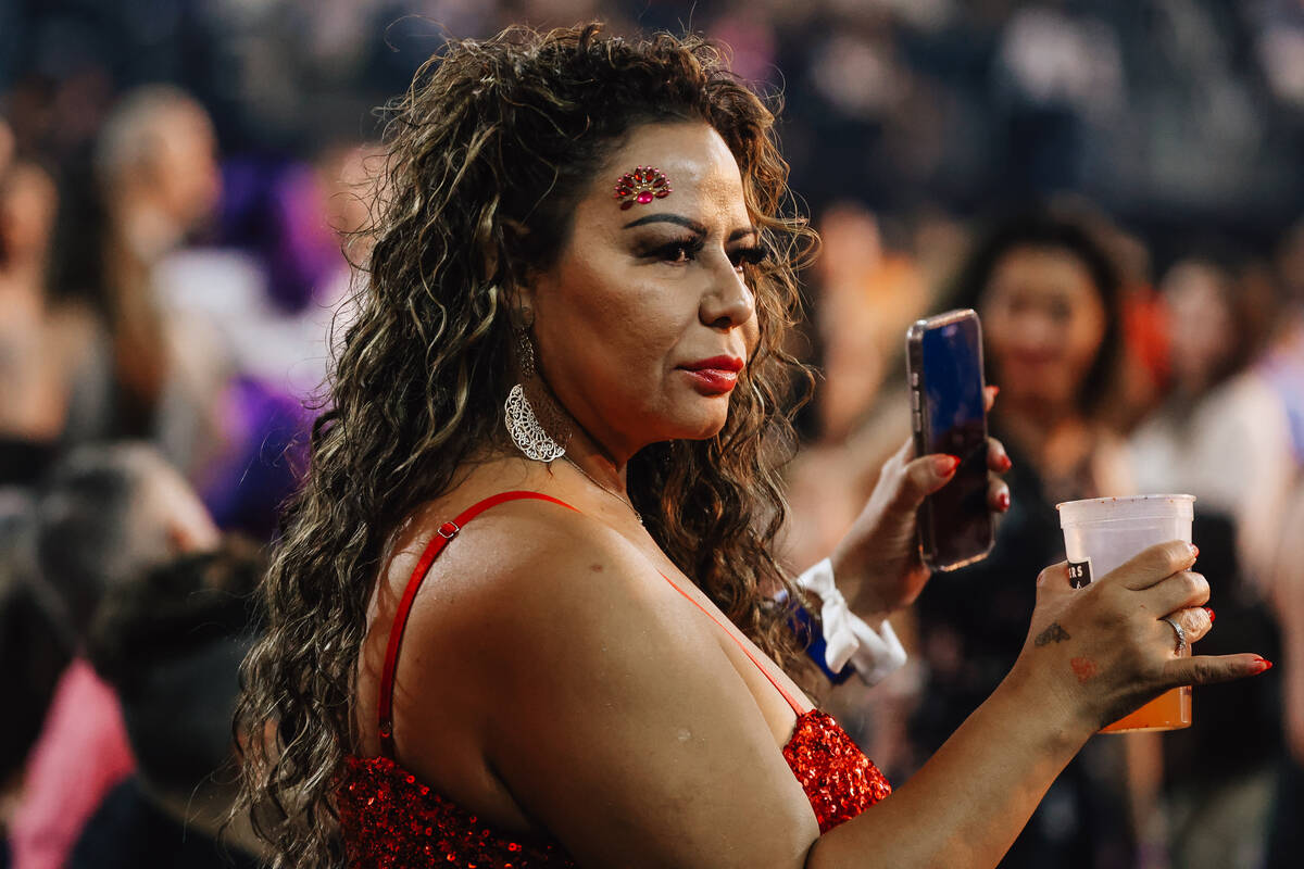 A fan waits for Shakira to come out during a concert at Allegiant Stadium Saturday June 28, 202 ...