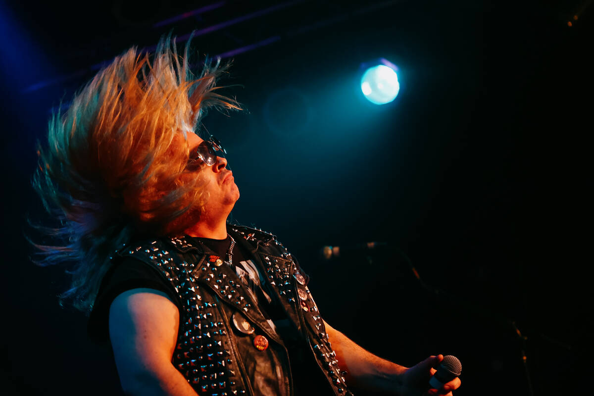 Rob Hussey from the band Cyanide flips his hair while performing with Count’s 77 on the ...