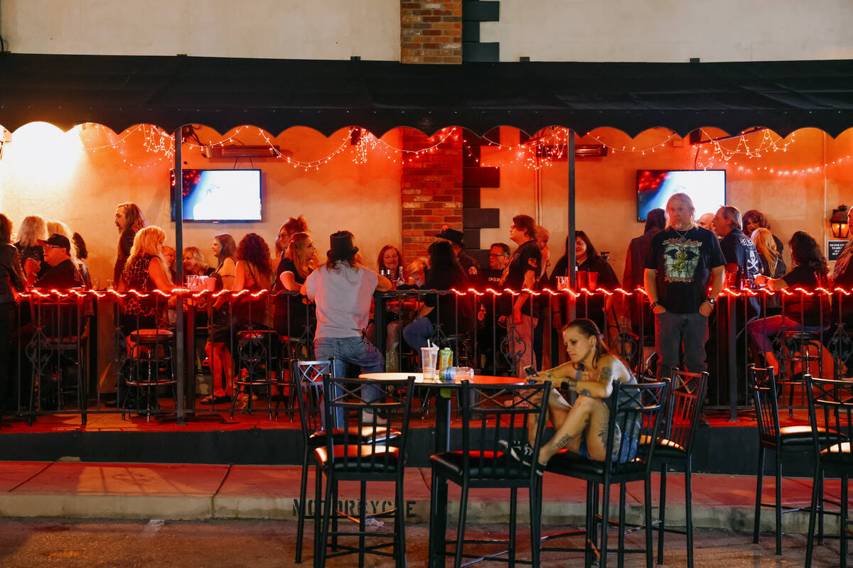 People hang out in the outdoor seating area and in the parking lot on the final night of operat ...