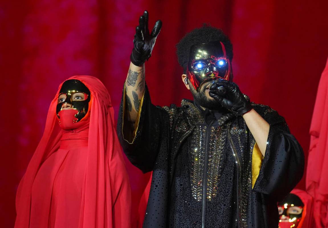 The Weeknd, right, performs on Wednesday, June 25, 2025, at SoFi Stadium in Inglewood, Calif. ( ...