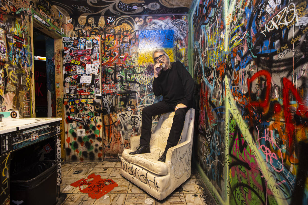 P Moss, owner of the Double Down Saloon, poses for a portrait in one of the bathrooms at the le ...