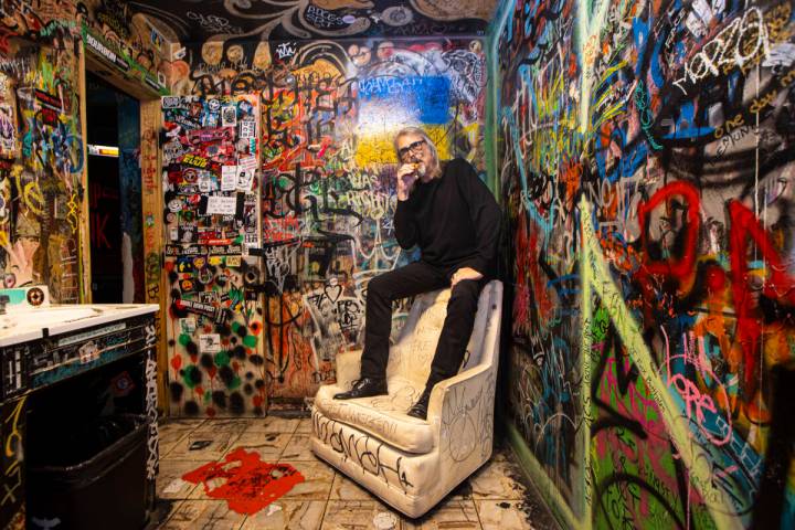 P Moss, owner of the Double Down Saloon, poses for a portrait in one of the bathrooms at the le ...
