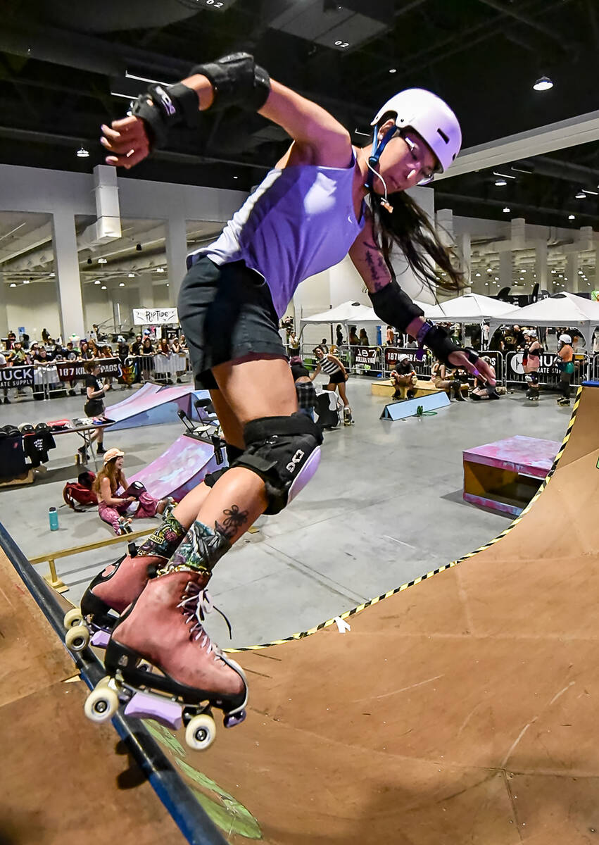 A skater drops in during a skate ramp competition as part of RollerCon. The five-day marathon o ...
