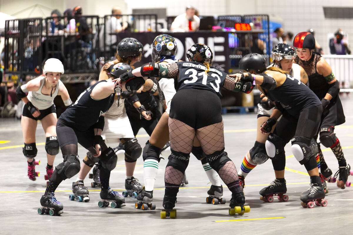 Two roller derby teams mix it up in a glam vs. goth match at 2024's RollerCon. The roller skati ...