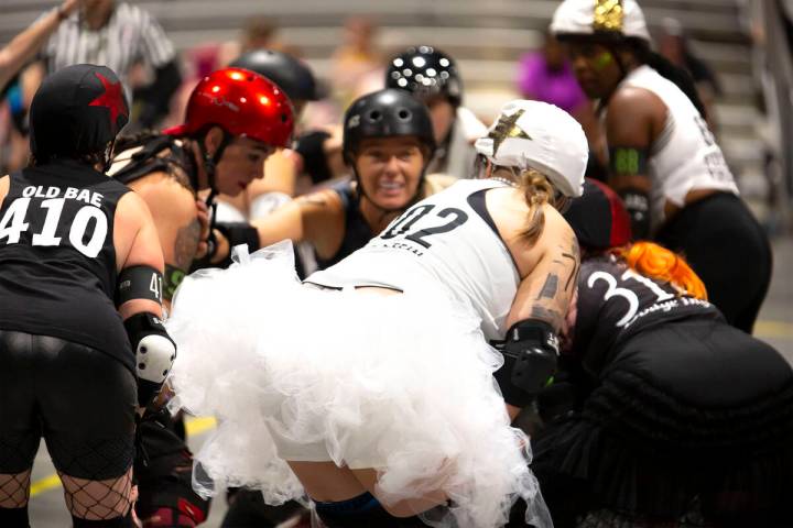 Two roller derby teams mix it up in a glam vs. goth match at 2024's RollerCon. The roller skati ...